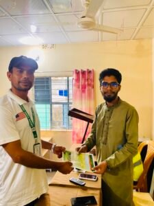 Green Fund Initiative volunteer sharing wildlife conservation information with a community member in Bangladesh