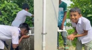 Schoolchildren using the newly installed water taps at a rural school in Netrokona, Bangladesh.